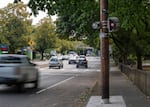 Cars drive by a traffic camera on Southeast Powell Boulevard near Southeast 23rd Avenue on Thursday, Sept. 18, 2025 in Portland, Ore. 