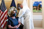 Speaker of the House Nancy Pelosi, D-Calif., receives a Pfizer-BioNTech COVID-19 vaccine shot by Dr. Brian Monahan, attending physician Congress of the United States in Washington, Friday, Dec. 18, 2020.