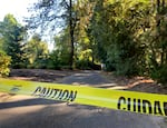 Caution tape surrounds the area around Lewis & Clark College’s swimming pool and lower Estate Garden on Aug. 30, 2022. One student died and two were injured Monday night when a free-standing column collapsed. Investigators learned that several hammocks were attached to the column when it collapsed.