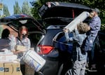 Zoë Diskin, center, gets help from her parents and boyfriend as they move her into her dorm in Corvallis, Ore., at Oregon State University, Sept. 20, 2021.