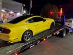 A yellow Mustang car is impounded near the intersection of Northeast Martin Luther King Jr. Boulevard and Northeast Columbia Boulevard after being involved with a street takeover, according to the Portland Police Bureau, in Portland, Ore., on Aug. 4, 2024.