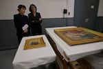 Recovered paintings "Portrait of Madame Colonna Romano" right, and "Young Woman at the Well," stolen from the Renoir Museum in Cagnes-sur-Mer are on display at the Interdisciplinary Centre for the Conservation and Restoration of Heritage in Marseille, France, Monday Oct. 12, 2026.