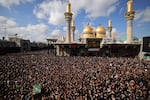 Shia Muslim pilgrims carry a symbolic coffin as they rally at the shrine of eighth century Imam Musa al-Kadhim during the yearly commemoration of his death in Baghdad's Kadhimiya district on Feb. 6.