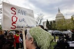 A person holds a sign reading "Save Our Social Security" during a rally in support of fair taxation near the U.S. Capitol on April 10, 2025.