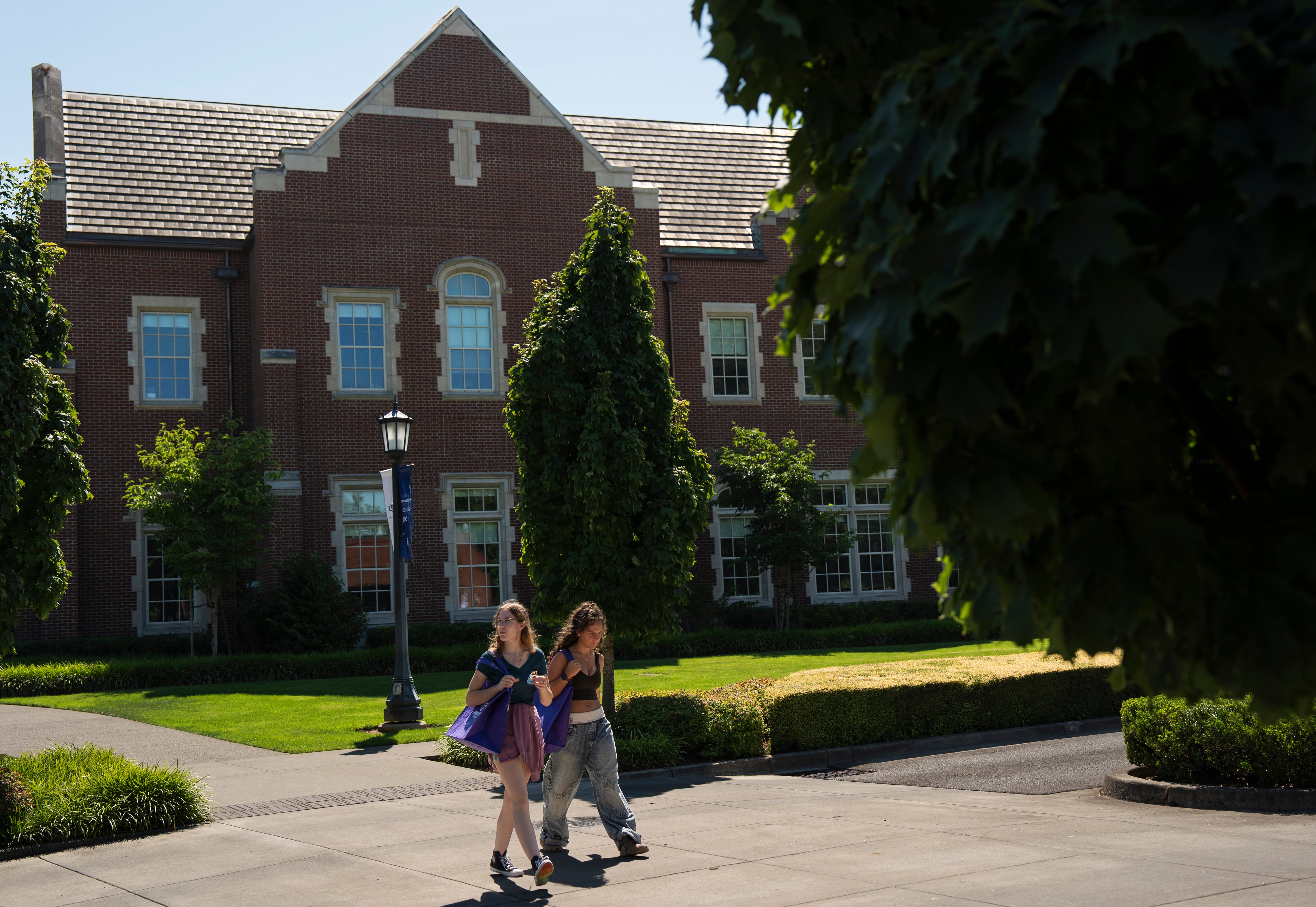 People walk on the University of Portland campus .