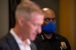 Portland Police Chief Chuck Lovell looks on as Mayor Ted Wheeler addresses a fatal shooting tied to protests during a press conference at City Hall in Portland, Ore., Aug. 30, 2020. One person was shot and killed as a pro-Trump car caravan rolled through town the previous evening.