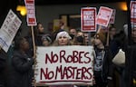 Anna Zwade, center, attends a rally to defend Roe v. Wade organized by now-former Seattle city councilmember Kshama Sawant on May 3, 2022, at Westlake Park in Seattle. The U.S. Supreme Court issued a ruling the following month reversing Roe, ending decades of federal protections for abortion access.