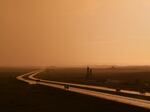 A rainstorm passes over Interstate 94 in Morton County, N.D., on May 25. Inclement weather and long travel distances to medical providers present serious access barriers for seniors here, many of whom are not able to drive or are uncomfortable driving in low-visibility conditions. 