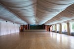 The main ballroom that overlooks the pool boasts crystal chandeliers and a painted backdrop of the Carpathian Mountains.