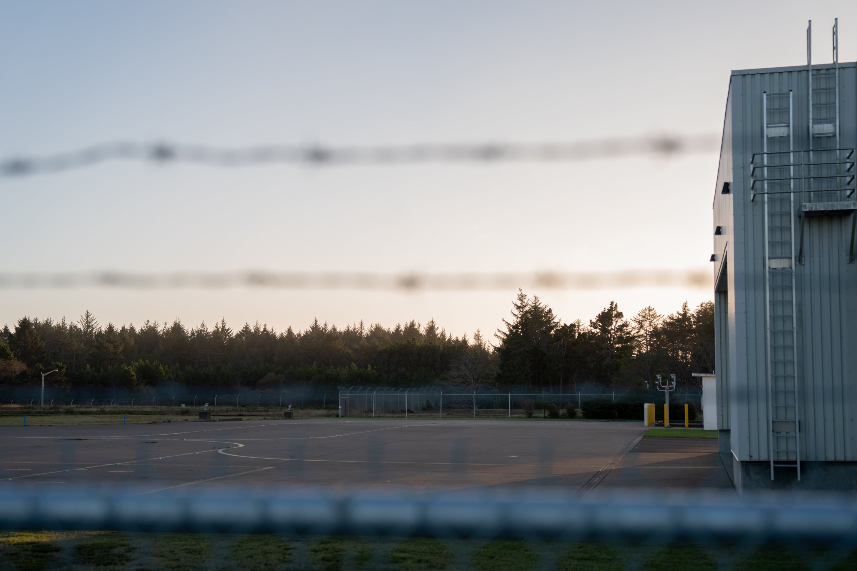 The area behind the U.S. Coast Guard facility where the rescue helicopter is stored at the Newport Municipal Airport, near the area that Immigration and Customs Enforcement is seemingly considering for a facility in Newport, Ore., on Nov. 17, 2025.