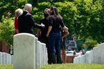 President Joe Biden and first lady Jill Biden talk with a family as they visit section 12 at Arlington National Cemetery, Monday, May 31, 2021, in Arlington, Va.