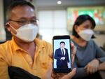 Goi Chee Kong shows a picture of his son Goi Zhen Feng, who died after falling prey to human trafficking, during a press conference in Petaling Jaya, Malaysia, on Sept. 21, 2022. Goi said he believed his 23-year-old son was forced to work for groups involved in online scams.