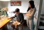 Xinmin Liang, 73, left, and his daughter Jie Liang, right, at Jie Liang’s Northeast Portland home, March 26, 2024. Xinmin Liang was attacked as he fished near the Vera Katz Eastbank Esplanade in Portland on March 13, 2024, and suffered a concussion and broken arm. 