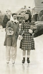 Lorraine Carter and Peggy Hawver laugh as they ice-skate home from store streets turned to ice rink, Portland, Ore., January 11, 1942