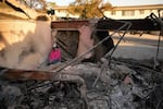 Saturday, Jan. 11: Kaegan Baron sits amid the rubble of her mother's home, which was destroyed by the Palisades Fire in the Pacific Palisades neighborhood of Los Angeles.