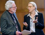 Sen. Dick Anderson, R-Lincoln City, left, and Majority Leader Kate Lieber, D-Beaverton and Southwest Portland, talk on the Senate floor, March 1, 2024, at the Capitol in Salem, Ore. Lieber and Rep. Jason Kropf, D-Bend, co-authored House Bill 4002.