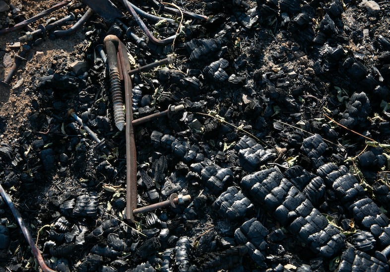 Charred remnants of a burned corral belonging to a neighbor of the Smulls in Rye Valley.