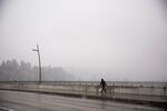 A person commuting by foot during the snowstorm in Portland, Oregon, Tuesday, Feb. 20, 2018.