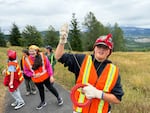 Akemi Sheibley, a freshman from Seattle, walks around a hike while holding a large balloon. Other girls in her group watch to make sure the balloon doesn’t get snagged on anything.