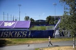 A person looks toward the Husky Soccer Stadium while jogging on Thursday, June 11, 2026, on the University of Washington campus in Seattle. The Washington State Legislature appropriated $4.3 million in practice field improvements for the 2026 World Cup.