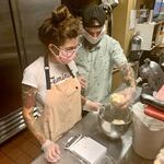 Serena Zendejas and her partner Jake weigh out dough. She spends three nights a week testing recipes and preparing ingredients, and spends the following mornings baking and making deliveries. 