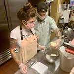 Serena Zendejas and her partner Jake weigh out dough. She spends three nights a week testing recipes and preparing ingredients, and spends the following mornings baking and making deliveries.