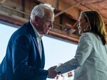 Democratic presidential nominee Vice President Kamala Harris and her running mate Minnesota Gov. Tim Walz hold hands during a campaign rally at Detroit Metropolitan Wayne County Airport, Wednesday, August 7, 2024, in Romulus, MI.