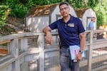 Dr. Carlos Sanchez, the head veterinarian at the Oregon Zoo, poses for a photo after examining goats at the Trillium Creek Family Farm at the Oregon Zoo on Aug. 18, 2023.
