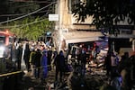 Residents and rescuers gather at the site of an Israeli airstrike in Beirut, Lebanon, Monday, Nov. 18, 2024.