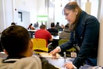 Immigration navigator Lydia Hernandez, right, assists a participant in a workshop offered by the Portland-based Innovation Law Lab, Jan. 8, 2025. The workshop provides support and legal guidance for participants representing themselves in the asylum process.