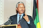Anti-apartheid activist Nelson Mandela delivers a policy statement in Johannesburg, South Africa, on Jan. 8, 1994. Mandela called on all South Africans to pledge themselves to peace. Later that year, Mandela became South Africa's first Black president.