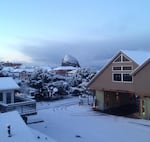 Snow is visible on Haystack Rock from Hemlock Street in Cannon Beach, Oregon, Monday, Feb. 4, 2019.