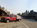 A fire truck parks in downtown Winthrop, Washington. The Methow Valley sees signs of fire nearly every summer, including vehicles filled with firefighters rattling down the highway or parked in town.