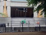 Police have erected fences and barricades outside downtown Portland's Justice Center, which houses courtrooms and a jail. In late May, demonstrators broke into the building, causing damage and lighting a fire. The site has since been home to nightly standoffs between protesters and law enforcement.