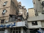 A view of buildings shows damage after what security sources said was a strike on Beirut's southern suburbs, on Tuesday.