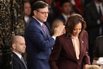 Vice President Harris certifies the Electoral College vote as Speaker Mike Johnson applauds during a joint session of Congress on Jan. 6, 2025, ratifying the 2024 presidential election.