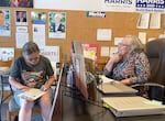 Marie Karns, right, chats with Shelley McNabb, left, at the Clackamas County Democrats office in downtown Oregon City, Ore., on Aug. 21, 2024. With Vice President Kamala Harris running for president, Karns says the office has seen a surge in phone calls and visitors.