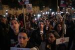 Family members of the hostages still held in Gaza and their supporters sing Israel's national anthem, Hatikvah, at the end of a rally that concluded their four-day march to Jerusalem on March 2. Darya Gonen(second row, right), was among them, wearing a black T-shirt with her sister's photo on it.