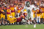 FILE — Oregon wide receiver Evan Stewart, right, ,breaks a tackle by Southern California safety Prophet Brown during the second half of an NCAA college football game, Saturday, Sept. 26, 2026, in Los Angeles.