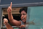 A protester shout slogans as they are detained and taken in a police vehicle during a protest demanding the resignation of Chief Election Commissioner Gyanesh Kumar in New Delhi, India, Saturday, Oct. 10, 2026.