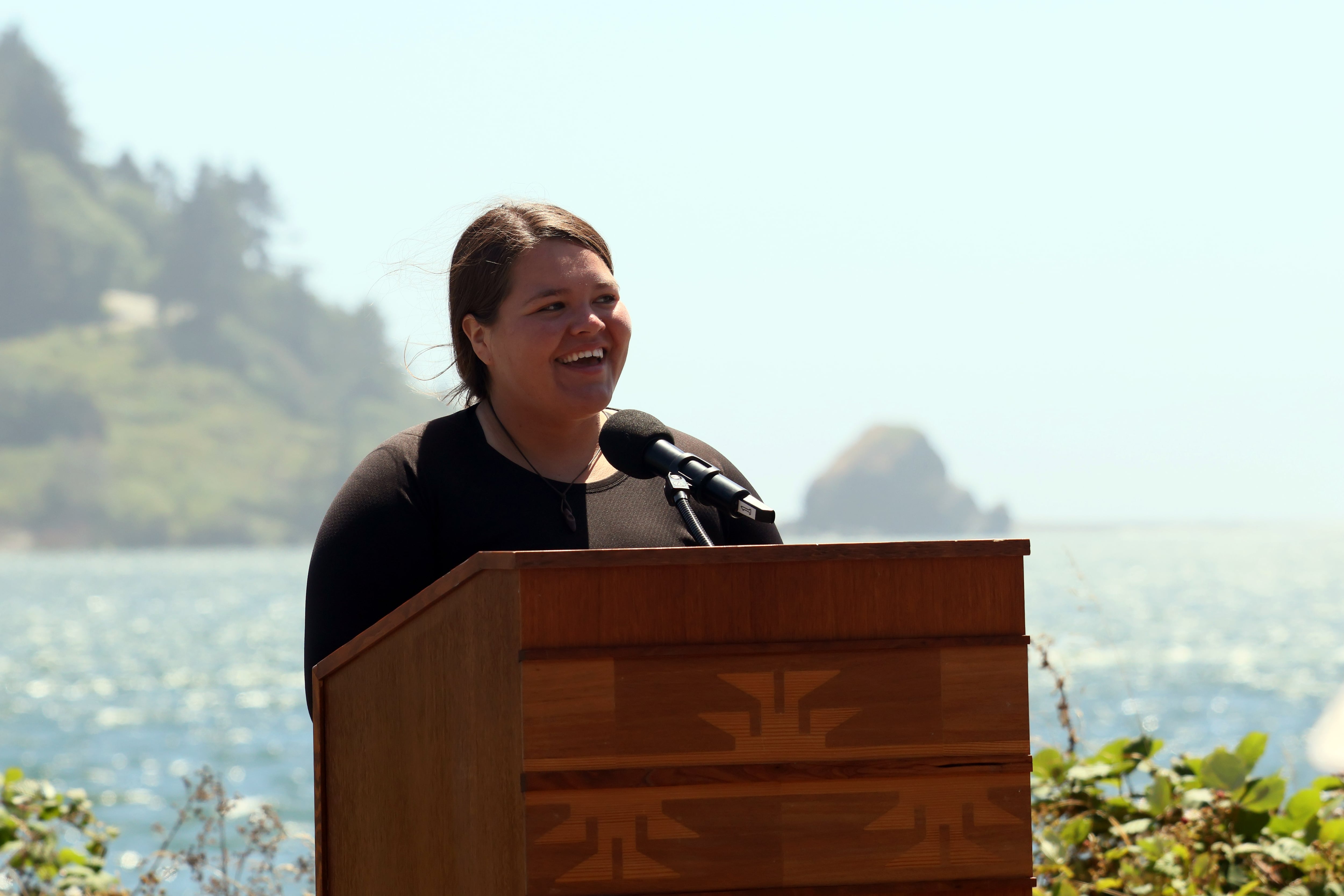 Danielle Frank, Hupa tribal member and Yurok descendant, director of Development and Community Relations for Ríos to Rivers, gives a speech during the community celebration on July 11, 2025.
