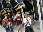 America Ferrera joins the SAG-AFTRA picket line in front of Netflix  in New York City. Actors who qualify get a very good deal on health insurance from their union.