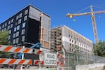 The first phase of the Next Generation Housing Development Plan, under construction on July 8, 2026, is set to be completed in the fall of 2027.