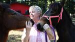 Michelle Martin with her horses. Martin is concerned her horses were sickened as a result of herbicide exposure. 