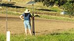 New farmer Bobbi Wilson stands on land in southern Oregon where she is prepping the land to grow vegetables.