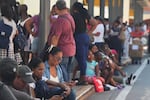 People gather outside a shopping mall after an earthquake hit Panama City, Friday, Oct. 9, 2026.