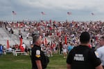 Law enforcement secure the area as people evacuate because of incoming storms that will delay the program at a Salute to America Independence Day event honoring the nation's 250th anniversary, Saturday, July 4, 2026, on the National Mall in Washington.