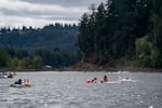 People float in the Willamette. 
