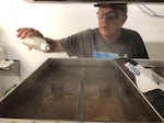 Neil McLeod, owner of Neil's Bigleaf Maple Syrup farm, keeps a close eye on his reducing sap for out of control foaming.