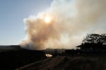The Old Trails Fire is seen from W. Northwest Blvd., on Aug. 1, 2026, in Spokane, Wash.